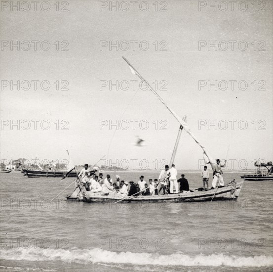 The Ghoghla to Diu ferry. Passengers are ferried across the Gulf of Cambay (Khambhat) from the mainland village of Ghoghla to Diu Island. Daman and Diu, India, circa 1937., Daman and Diu, India, Southern Asia, Asia.