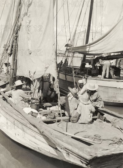 Boats moored at Port au Prince. Sailing boats are moored off shore at Port au Prince. Port au Prince, Haiti, circa 1930. Port au Prince, Ouest, Haiti, Caribbean, North America .