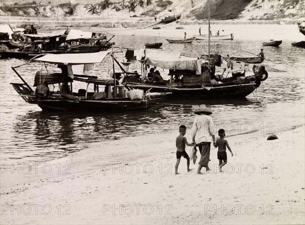 Sampans at Repulse Bay. Sampans and row boats are moored in shallow water at Repulse Bay. Hong Kong Island, China, 1963. Hong Kong, Hong Kong, China, People's Republic of, Eastern Asia, Asia.