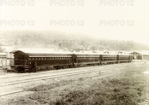 New Trinidad Government Railway passenger train. View of a new Trinidad Government Railway passenger train sitting on sidings near a railway depot. Trinidad, circa 1912., Trinidad and Tobago, Trinidad and Tobago, Caribbean, North America .