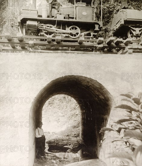 Locomotive travelling across culvert 'No. 35' . A steam locomotive travels across culvert 'No. 35' on an extended section of railway line built by Trinidad Government Railways to connect Rio Claro to the rail network. Trinidad, 11 September 1913., Trinidad and Tobago, Trinidad and Tobago, Caribbean, North America .