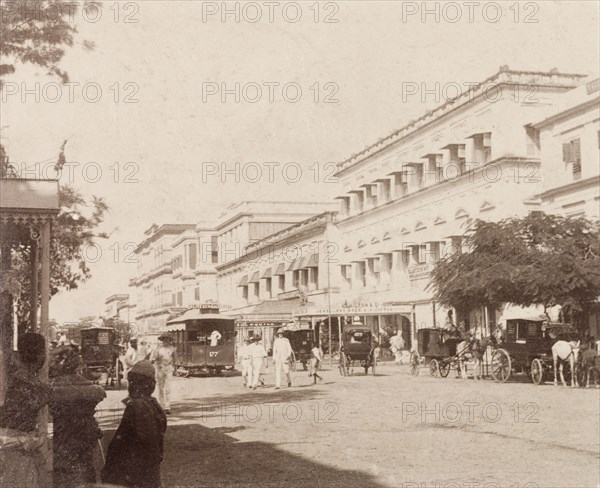 Old Court House Street, Calcutta. View down Old Court House Street in Calcutta, a commercial road bustling with horse-drawn carriages, pedestrians and trams. Calcutta (Kolkata), India, 1887. Kolkata, West Bengal, India, Southern Asia, Asia.