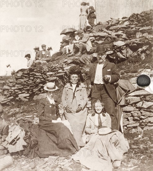 Friends posing on the slopes of Snowdon. Minnie Murray (far left) and friends pose for a group portrait on the slopes of Snowdon, the highest mountain in Wales. The Snowdon Mountain Railway service opened in 1896, enabling visitors to travel up to the mountain peak. Caernarfonshire, Wales, 1901., Caernarfonshire, Wales (United Kingdom), Western Europe, Europe .