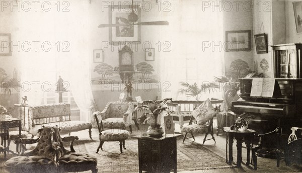 Drawing room of 12 Government Place, Calcutta. The newly-refurbished, elegant drawing room of the flat above the family-owned chronometers 'James Murray and Co.', located at 12 Government Place. Calcutta (Kolkata), India, circa 1910. Kolkata, West Bengal, India, Southern Asia, Asia.