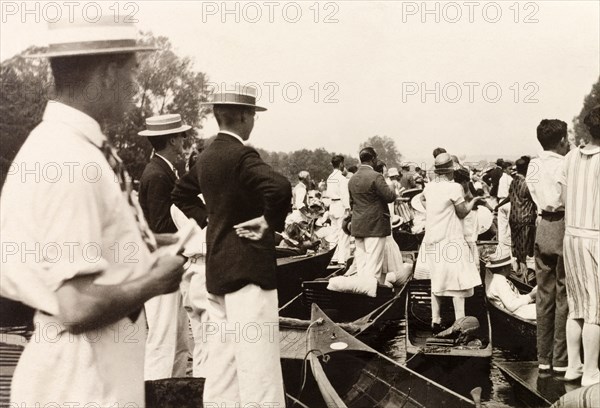 Henley Royal Regatta, 1929. Spectators gather on punts on the River Thames to watch a boat race at the Henley Royal Regatta. Henley-on-Thames, England, July 1929. Henley on Thames, Oxfordshire, England (United Kingdom), Western Europe, Europe .