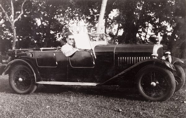 Embarking on a journey on the Grand Trunk Road. British colonist Noel Stokes sits in his Avion Voisin car as he prepares to embark on a journey along the Grand Trunk Road from Calcutta to Ranchi. Calcutta (Kolkata), India, June 1932. Kolkata, West Bengal, India, Southern Asia, Asia.