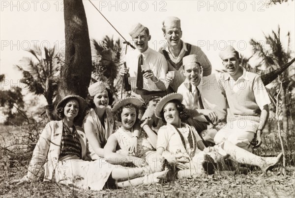 Friends enjoying a picnic, Calcutta. A group of British friends pose for a portrait during a picnic at Diamond Harbour. Calcutta (Kolkata), India, 1933. Kolkata, West Bengal, India, Southern Asia, Asia.