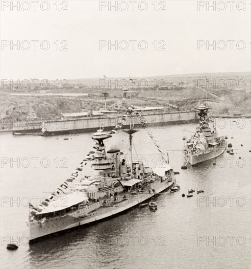 Ships decorated for Empire Day, Malta. Two large steamships leave Grand Harbour in Valetta, decorated with flags of the British Empire to celebrate Empire Day. Valetta, Malta, 24 May 1933. Valetta, Malta, Malta, Central Europe, Europe .