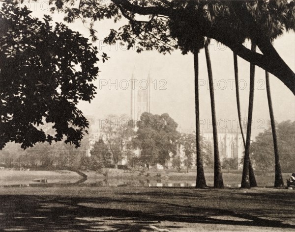 St. Paul's Cathedral, Calcutta. View over an open landscape to St. Paul's Cathedral in Calcutta, shortly after an earthquake demolished the cathedral's spire. Calcutta (Kolkata), India, circa 1934. Kolkata, West Bengal, India, Southern Asia, Asia.