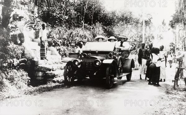 European women in convertible car, Ceylon. Three European women travel in a convertible car along a Ceylonian village road.
Ceylon (Sri Lanka), 1912. Sri Lanka, Southern Asia, Asia.