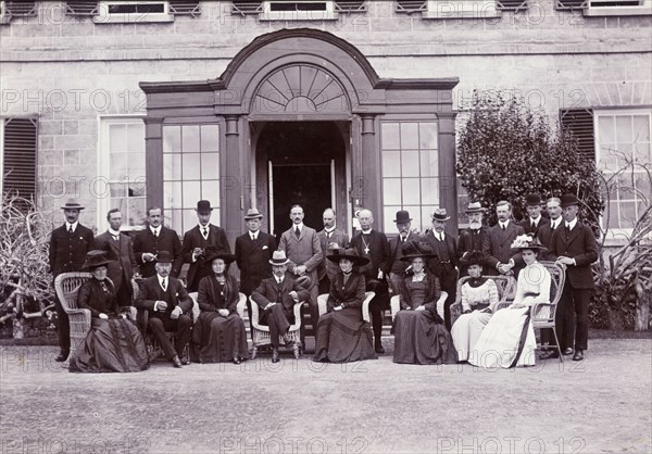 Duke of Connaught in St Helena. The Duke and Duchess of Connaught assemble for a photograph with European dignitaries outside Government House. This was one of several stops made by the royal couple on their way to Cape Town to open the new Union Parliament. St Helena, 25 October 1910. St Helena, Atlantic Ocean, Africa.