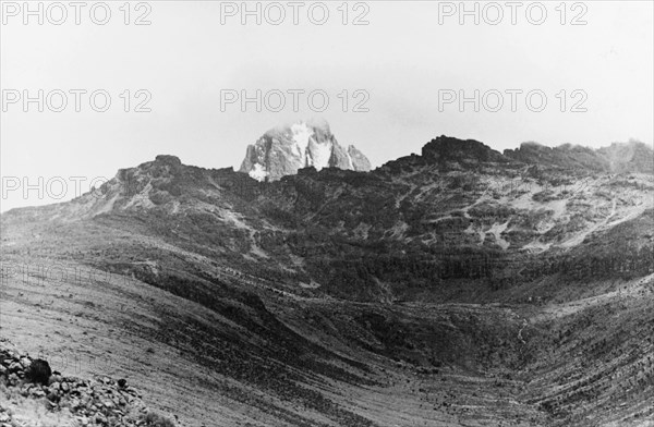 Mount Kenya, 1936. The summit of Mount Kenya is partially obscured by cloud. Kenya, circa 1936. Kenya, Eastern Africa, Africa.