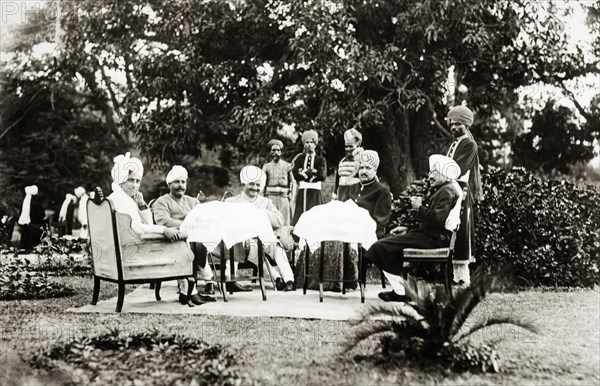 The Maharaja of Indore's ministers. The Prime Minister and state officials of Indore at a garden party held in the PM's palace gardens. The party was thrown in honour of a visit by Lord Irwin, the Viceroy of India. Indore, Indore State (Madhya Pradesh), India, 2 August 1928. Indore, Madhya Pradesh, India, Southern Asia, Asia.
