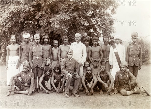 Indian Forest Officers, beaters and trackers. Group portrait of the Indian Forest Officers, beaters and trackers who accompanied Sir Arthur Lawley, Governor of Madras, and the Elaya Rajah (heir apparent) of Nilambur, on a hunting expedition in the Nilgiri Hills. Edakkara, Malabar District (Kerala), India, March 1908., Kerala, India, Southern Asia, Asia.