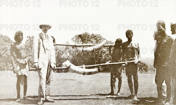 Tusks of the second elephant bagged by the Governor'. Four Indian servants display the tusks of an elephant shot by Sir Arthur Lawley, the Governor of Madras, during a hunting expedition in the Nilgiri Hills with the Elaya Rajah (heir apparent) of Nilambur. Edakkara, Malabar District (Kerala), India, March 1908., Kerala, India, Southern Asia, Asia.