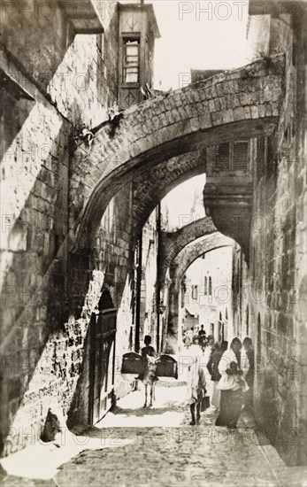 Via Dolorosa, Jerusalem. View down Via Dolorosa, a street in the old city of Jerusalem, which Jesus is believed to have walked through on the way to his crucifixion. Jerusalem, British Mandate of Palestine (Israel), circa 1942. Jerusalem, Jerusalem, Israel, Middle East, Asia.