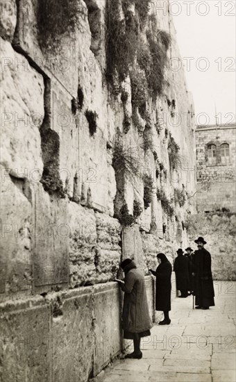 The Wailing Wall, Jerusalem. Jewish people pray at the Wailing Wall (Western Wall or The Kotel) in Jerusalem. Jerusalem, British Mandate of Palestine (Israel), circa 1942. Jerusalem, Jerusalem, Israel, Middle East, Asia.