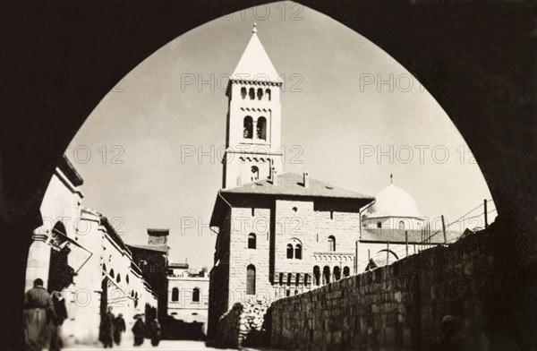 Church of the Redeemer, Jerusalem. View through an archway to the Church of the Redeemer, a Lutheran church built by Kaiser Wilhelm II (1859-1941) in the late 19th century. Jerusalem, British Mandate of Palestine (Israel), circa 1942. Jerusalem, Jerusalem, Israel, Middle East, Asia.