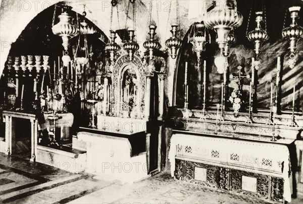 Calvary Altar, Church of the Holy Sepulchre. View of the ornate Calvary Altar in the Church of the Holy Sepulchre, a Christian church believed to be built over Calvary (Golgotha), the hill on which Jesus was crucified. Jerusalem, British Mandate of Palestine (Israel), circa 1942. Jerusalem, Jerusalem, Israel, Middle East, Asia.