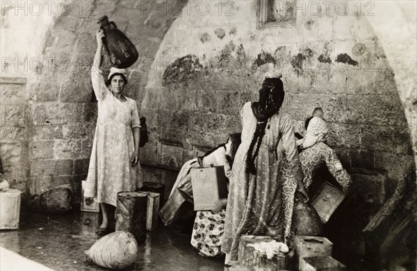 The Virgin's Fountain, Nazareth. Women collect water from the Virgin's Fountain (also known as Mary's Well) in Nazareth. According to Greek Orthodox tradition, the archangel Gabriel revealed the Annunciation to Mary, the mother of Jesus, as she was collecting water from a well near this site. Nazareth, British Mandate of Palestine (Israel), circa 1942. Nazareth, North (Israel), Israel, Middle East, Asia.