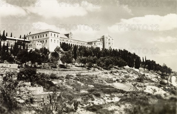 Salizian School', Nazareth. View of a large, majestic building situated atop a wooded hill, originally captioned as 'Salizan School'. Nazareth, British Mandate of Palestine (Middle East), circa 1942. Nazareth, North (Israel), Israel, Middle East, Asia.