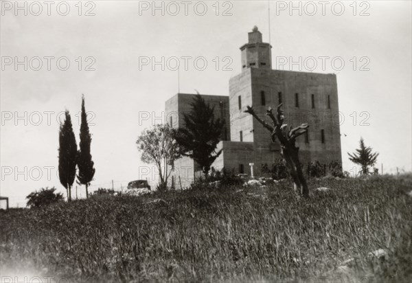Fortified police building, Palestine. View of a large, fortified building with a projecting octagonal watchtower. This building was possibly used by British police forces as a gaol or police headquarters. British Mandate of Palestine (Middle East), circa 1942., Middle East, Asia.
