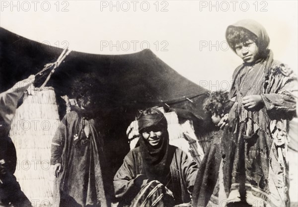 A bedouin family, Palestine. A bedouin family at the entrance to their tent. British Mandate of Palestine (Middle East), circa 1938., Middle East, Asia.