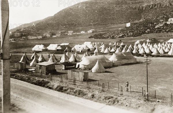 Camp of the First Battalion Irish Guards, Nablus. Lines of army bell tents are pitched at Nablus, at a military camp belonging to the First Battalion Irish Guards. During the period of the Great Uprising (1936-39), an additional 20,000 British troops were deployed to Palestine in an attempt to clamp down on Arab dissidence. Nablus, British Mandate of Palestine (West Bank, Middle East), circa 1938. Nablus, West Bank, West Bank (Palestine), Middle East, Asia.