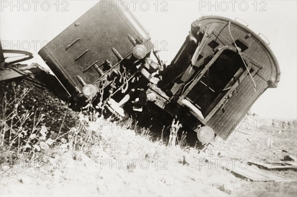 Derailed carriages at Ras el Ain. Two railway carriages lie upturned on a railway embankment, derailed in a sabotage attack by Palestinian Arab dissidents during the Great Uprising (1936-39). Ras el Ain, British Mandate of Palestine (Israel), circa 1938. Israel, Middle East, Asia.