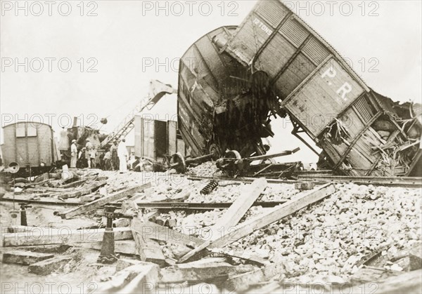 Derailed freight cars at Lydda. Several freight cars lie in a tangled heap, derailed in a sabotage attack by Palestinian Arab dissidents during the Great Uprising (1936-39). Lydda, British Mandate of Palestine (Lod, Israel), circa 1938. Lod, Central (Israel), Israel, Middle East, Asia.