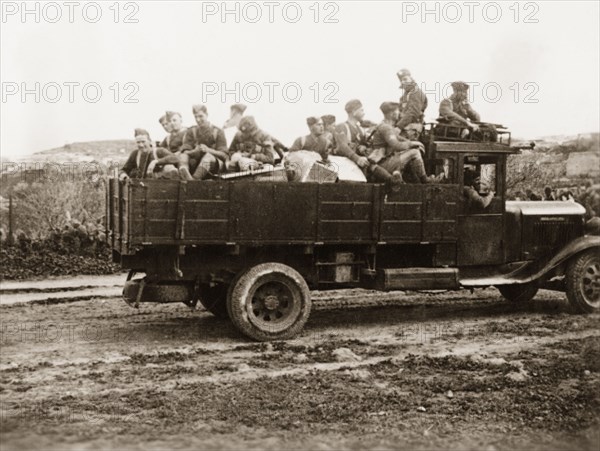 British soldiers in Palestine. A troop of British soldiers travel through the Palestinian countryside in an open-topped truck. During the period of the Great Uprising (1936-39), an additional 20,000 British troops were deployed to Palestine in an attempt to clamp down on Arab dissidence. British Mandate of Palestine (Middle East), circa 1938., Middle East, Asia.