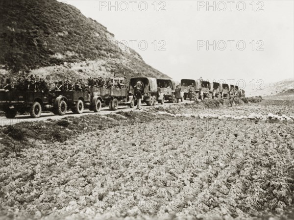 British military trucks in Palestine. A column of military trucks transport British soldiers through the Palestinian countryside. During the period of the Great Uprising (1936-39), an additional 20,000 British troops were deployed to Palestine in an attempt to clamp down on Arab dissidence. British Mandate of Palestine (Middle East), circa 1938., Middle East, Asia.