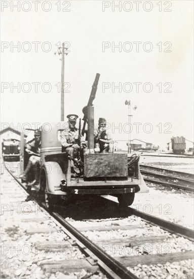 Rail trolley from Israel to Egypt. British soldiers armed with light mortar ride a rail trolley across the border of the British Mandate of Palestine into Egypt. British Mandate of Palestine (Middle East), circa 1938. Israel, Middle East, Asia.