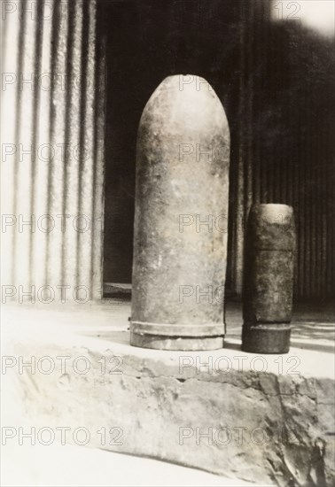 Bombs from Palestine. Two bombs, made of 'old shell' according to an original caption, sit side by side on a stone step. British Mandate of Palestine (Middle East), circa 1938., Middle East, Asia.