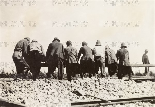 Relaying railway lines, Palestine. A team of labourers relay a stretch of railway track following a derailment caused by Palestinian Arab dissidents during the Great Uprising (1936-39). British Mandate of Palestine (Middle East), circa 1938., Middle East, Asia.