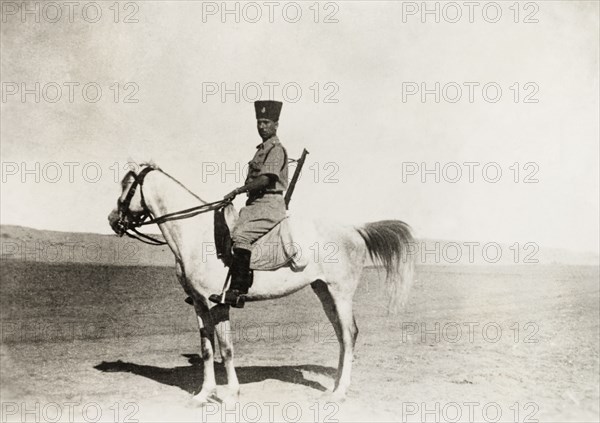 Palestine Police patrolling Gaza. A mounted officer of the Palestine Police Force patrols the desert around Gaza during the period of the Great Uprising (1936-39). Gaza, British Mandate of Palestine (Gaza Strip, Middle East), circa 1938., Middle East, Asia.