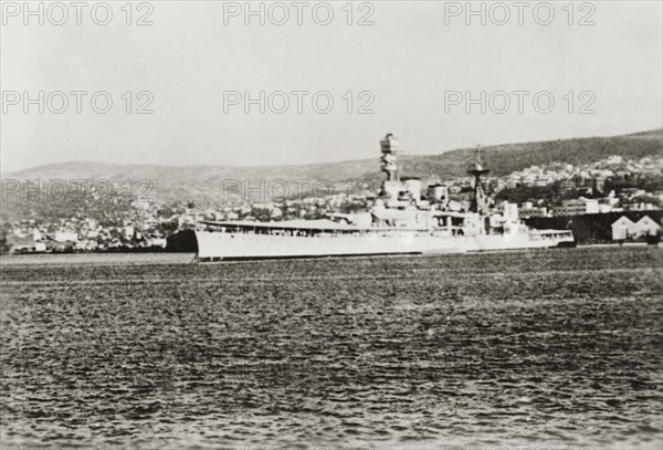 HMS Valiant at Haifa. View of the British battleship HMS Valiant, moored in the Mediterranean Sea at Haifa port. Haifa, British Mandate of Palestine (Israel), circa 1939. Haifa, Haifa, Israel, Middle East, Asia.