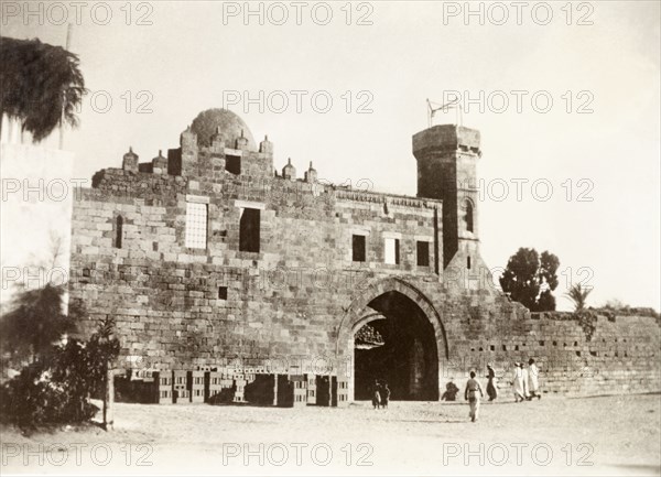 Government House, Gaza. View of Government House in Gaza, a fortified building accessed through a large, arched gateway. Gaza, British Mandate of Palestine (Gaza Strip, Middle East), circa 1938., Middle East, Asia.