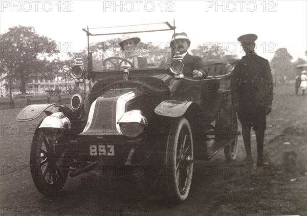 Minnie Murray drives a Renault car. Minnie Murray sits behind the wheel of a Renault car with her husband James who travels in the passenger seat beside her. Calcutta (Kolkata), India, 1908. Kolkata, West Bengal, India, Southern Asia, Asia.