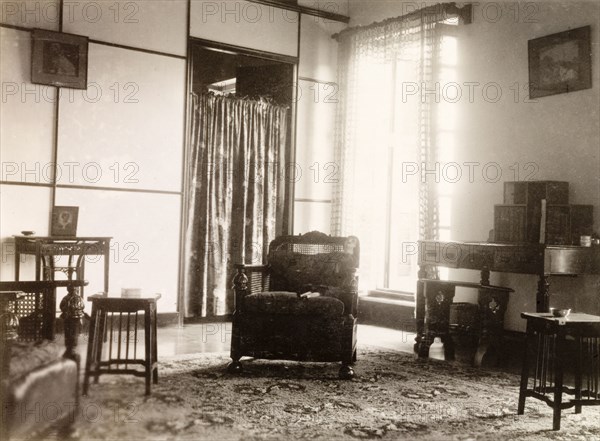 A 1930s drawing room in Calcutta. The interior of a 1930s drawing room, located in the flat above 'James Murray & Co.' at Old Court House Street, Calcutta. James Murray & Co. was a British-owned family business that specialised in making chronometers and also operated as a jewellers and opticians. Calcutta (Kolkata), India, 1932. Kolkata, West Bengal, India, Southern Asia, Asia.
