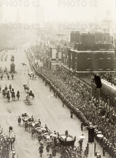King George VI's coronation procession. Crowds of spectators line Whitehall to watch the coronation procession of King George VI on its way to Westminster Abbey. The King and Queen Elizabeth travel in the Gold State Coach, preceded by a mounted military escort. London, England, 12 May 1937. London, London, City of, England (United Kingdom), Western Europe, Europe .