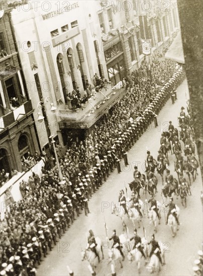 King George VI's coronation procession. Crowds of spectators line Whitehall to watch the coronation procession of King George VI on its way to Westminster Abbey. Cavalry regiments of the British Army precede the King and Queen Elizabeth who were escorted through the streets in the Gold State Coach. London, England, 12 May 1937. London, London, City of, England (United Kingdom), Western Europe, Europe .