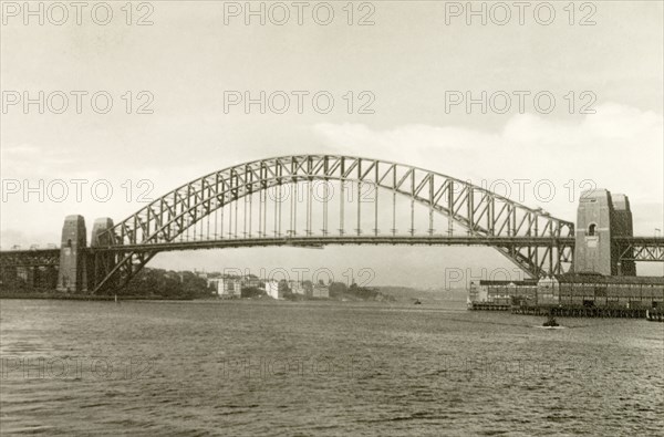 Sydney Harbour Bridge, 1940. View of Sydney Harbour Bridge, stretching across Port Jackson to connect Dawes Point and Milsons Point. Formally opened on 19 March 1932, the bridge was nicknamed 'the coathanger' due to its its arch-based design. Sydney, Australia, April 1940. Sydney, New South Wales, Australia, Australia, Oceania.