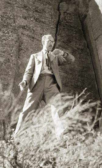 Sixteen feet per second'. James Murray times a falling stone in Burragorang Valley whilst on holiday in the Blue Mountains. An original caption written by Murray himself indicates the stone fell at a rate of "sixteen feet per second". New South Wales, Australia, May 1940., New South Wales, Australia, Australia, Oceania.