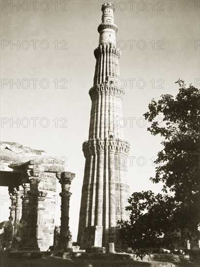 Qutb Minar, 1941. View of the Qutb Minar, one of the greatest monuments of Islamic architecture in India. At 72.5 metres tall, it was built as a celebratory victory tower to accompany the Quwwat-ul-Islam mosque, and was probably inspired by the style of Afghan minarets. Delhi, India, 1941. Delhi, Delhi, India, Southern Asia, Asia.