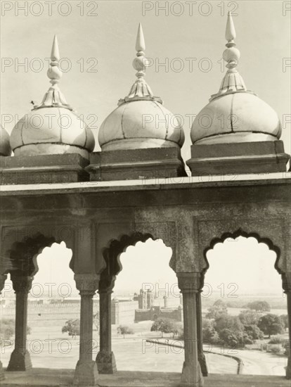 Domes archways in Old Delhi. View through a colonnade of domed archways in Old Delhi, looking towards the Delhi Fort in the distance. Delhi, India, 1941. Delhi, Delhi, India, Southern Asia, Asia.