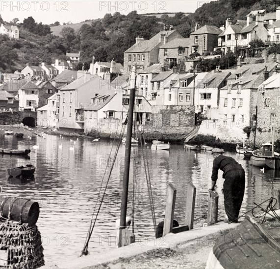 Polperro, Cornwall, 1952. Tightly-packed houses overlook the harbour at the picturesque fishing village of Polperro. Polperro, Cornwall, England, 1952., Cornwall, England (United Kingdom), Western Europe, Europe .