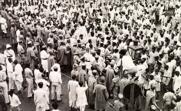 Policing the riots in Calcutta, 1946. Indian police form a barricade with lathis (bamboo sticks) to control crowds of Indian protesters on Old Court House Street. The photographer refers to the event as a "Communist riot", but it could be any one of a number of uprisings that plagued Calcutta in 1946. Two occasions that seem to fit are an attempt by student demonstrators to enter Dalhousie Square on 11 February, or the August riots relating to Direct Action Day. Calcutta (Kolkata), India, 1946. Kolkata, West Bengal, India, Southern Asia, Asia.