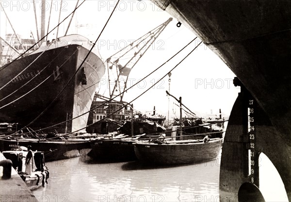 Calcutta docks, 1930. Steamships and barges are moored at Calcutta docks. Calcutta (Kolkata), India, circa 1930. Kolkata, West Bengal, India, Southern Asia, Asia.