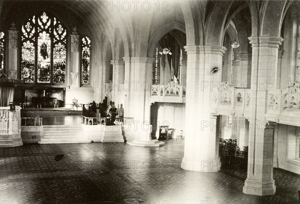 Interior of Medak Cathedral. Interior view of the nave in Medak Cathedral, looking towards to the stained glass windows at the high altar. Medak Cathedral was built by Wesleyan Methodist missionaries in Gothic architectural style during the First World War (1914-1918). Medak, Andhra Pradesh, India, 1933., Andhra Pradesh, India, Southern Asia, Asia.